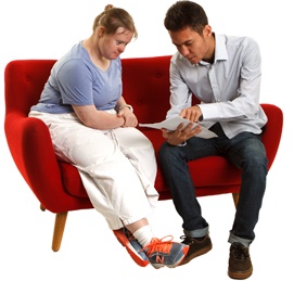 man explaining document to woman
