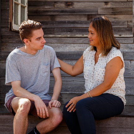 woman comforting a man.