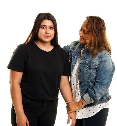 woman holding the arm of another woman