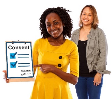 woman pointing at consent form with another woman standing in the back.